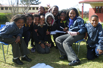 A group of South African students outside their classrooms